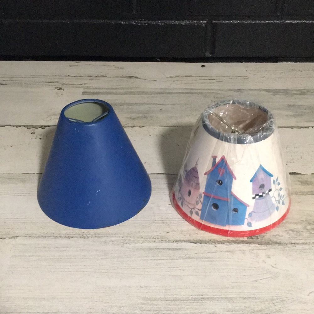 Two small clip on lampshades. Solid blue metal & white paper with birdhouses